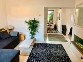 Stylish house & garden on quiet road. Easy free parking.